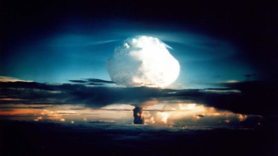 A mushroom cloud is rising in the center of a highly saturated photo