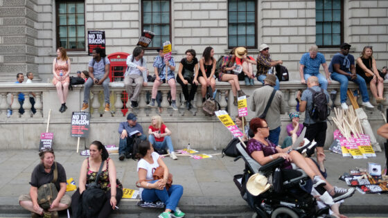 A group of protestors rest during a rally