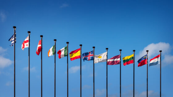 National flags of the European countries against the blue sky